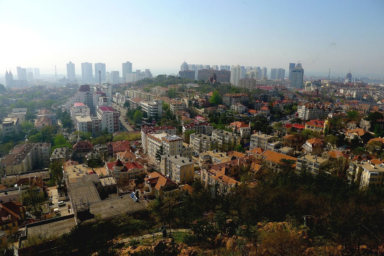 Aerial view of Qingdao old town red roofs and coastline