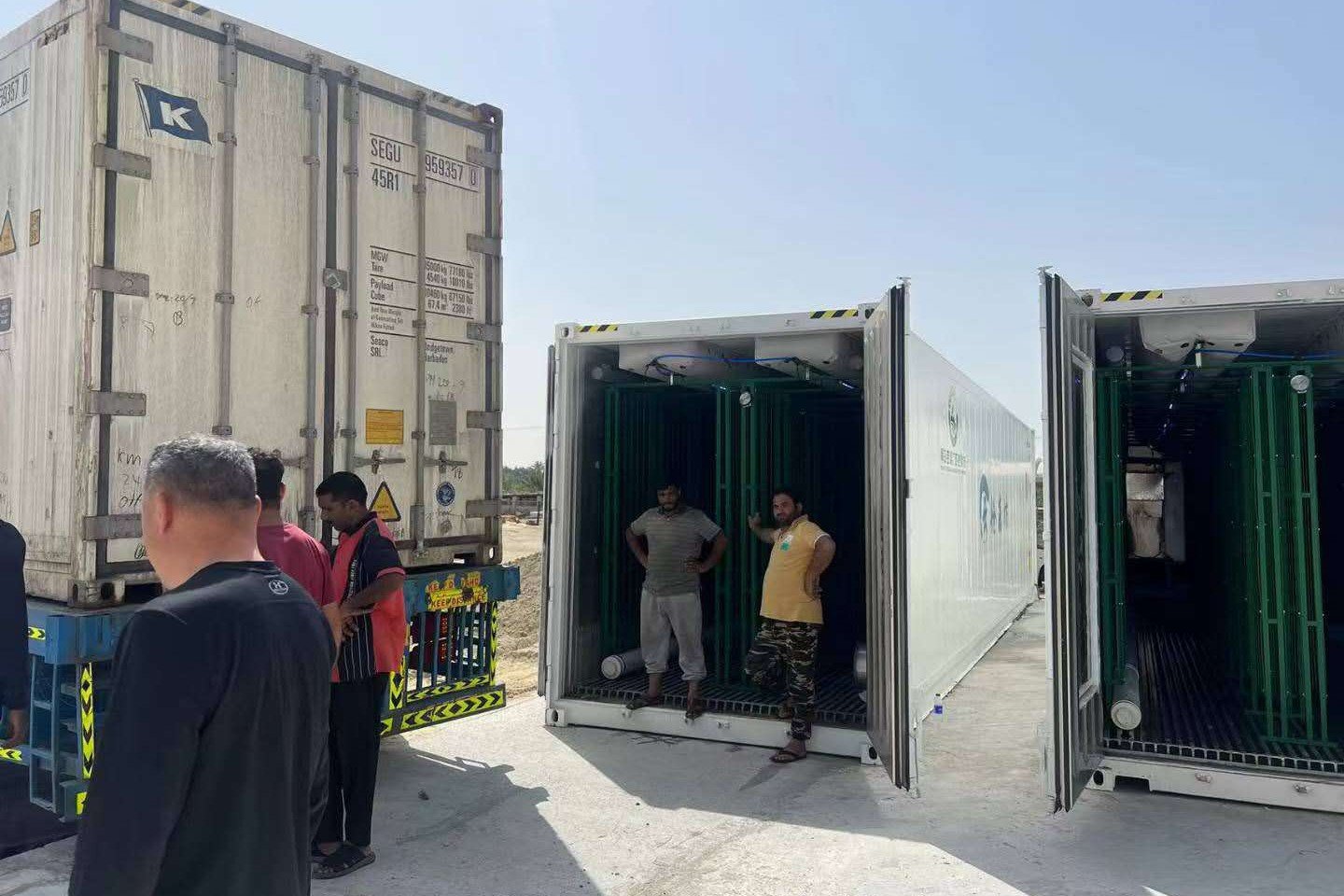 Container mushroom farm units delivered by truck to the Sharjah site