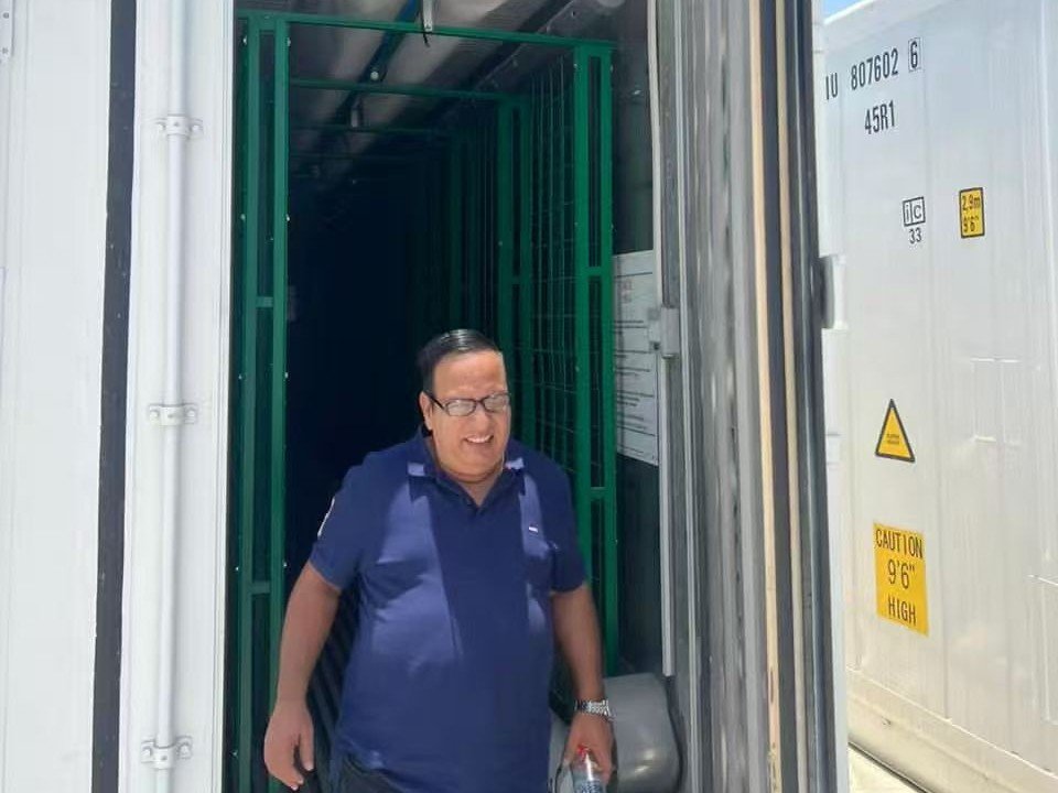 Client visiting the container mushroom growing room at the Sharjah project