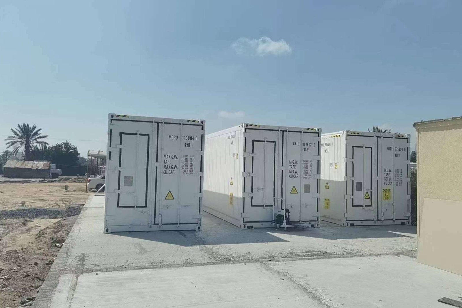 Row of refrigerated container farm units at the Sharjah project site